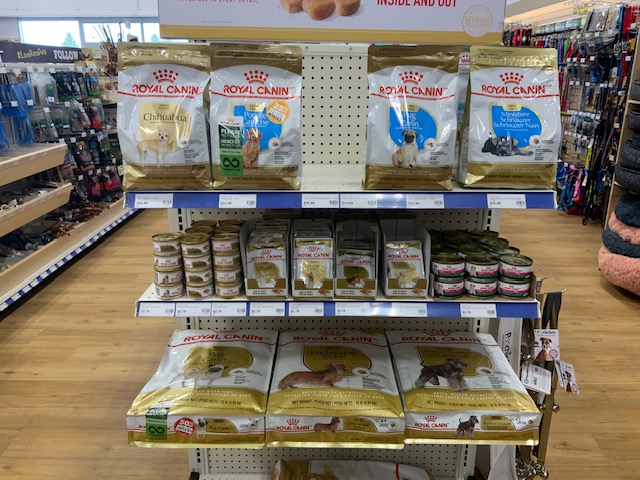 Display rack of dog food packages at pet store.